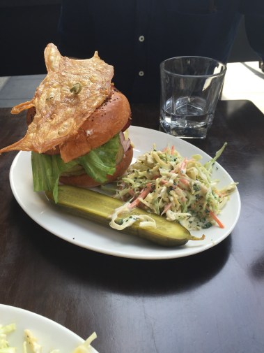 Jeremy's fried chicken sandwich with fried chicken skin on top. 